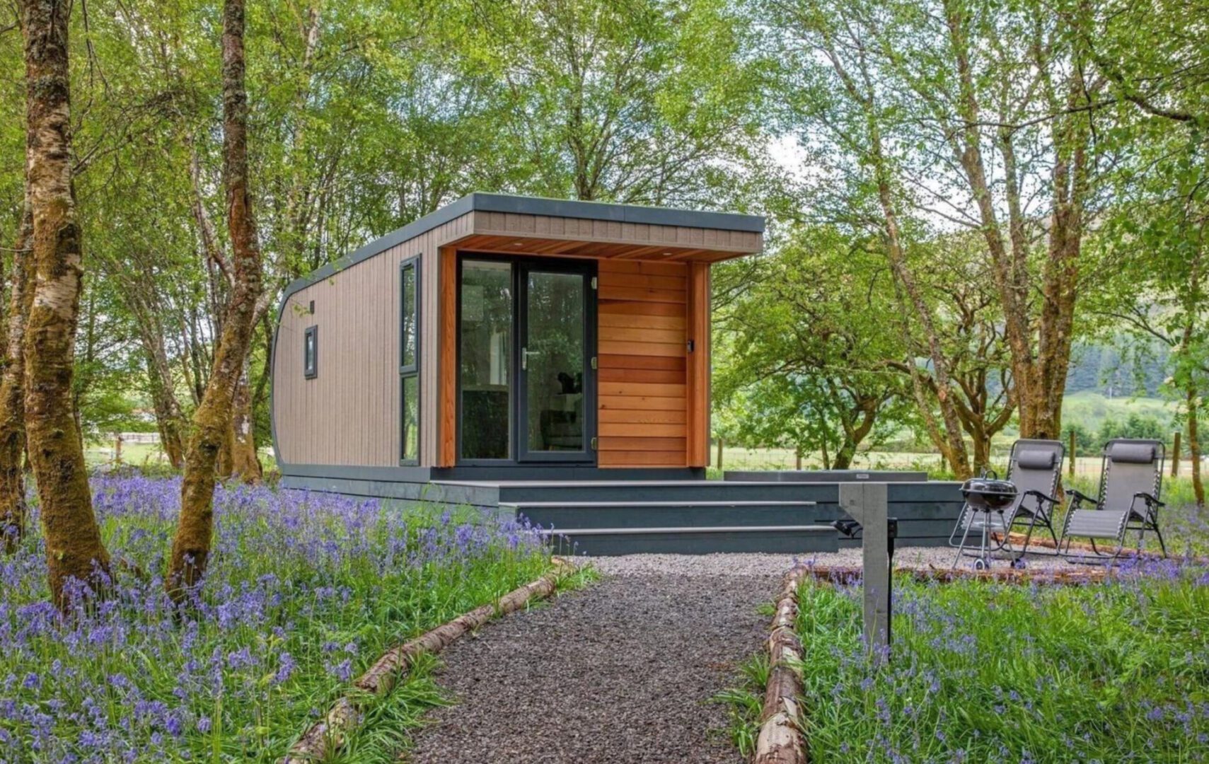 A small house in the middle of a park.